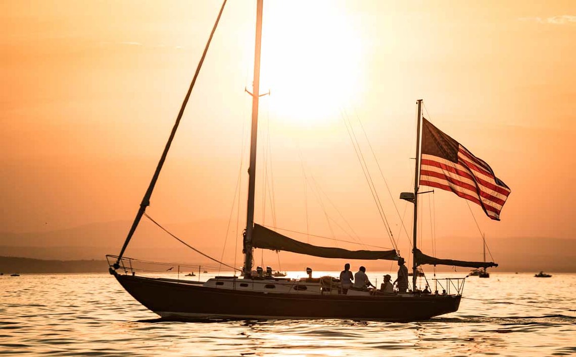 sailboat against orange sunset - metaphor for ADA website remediation providers